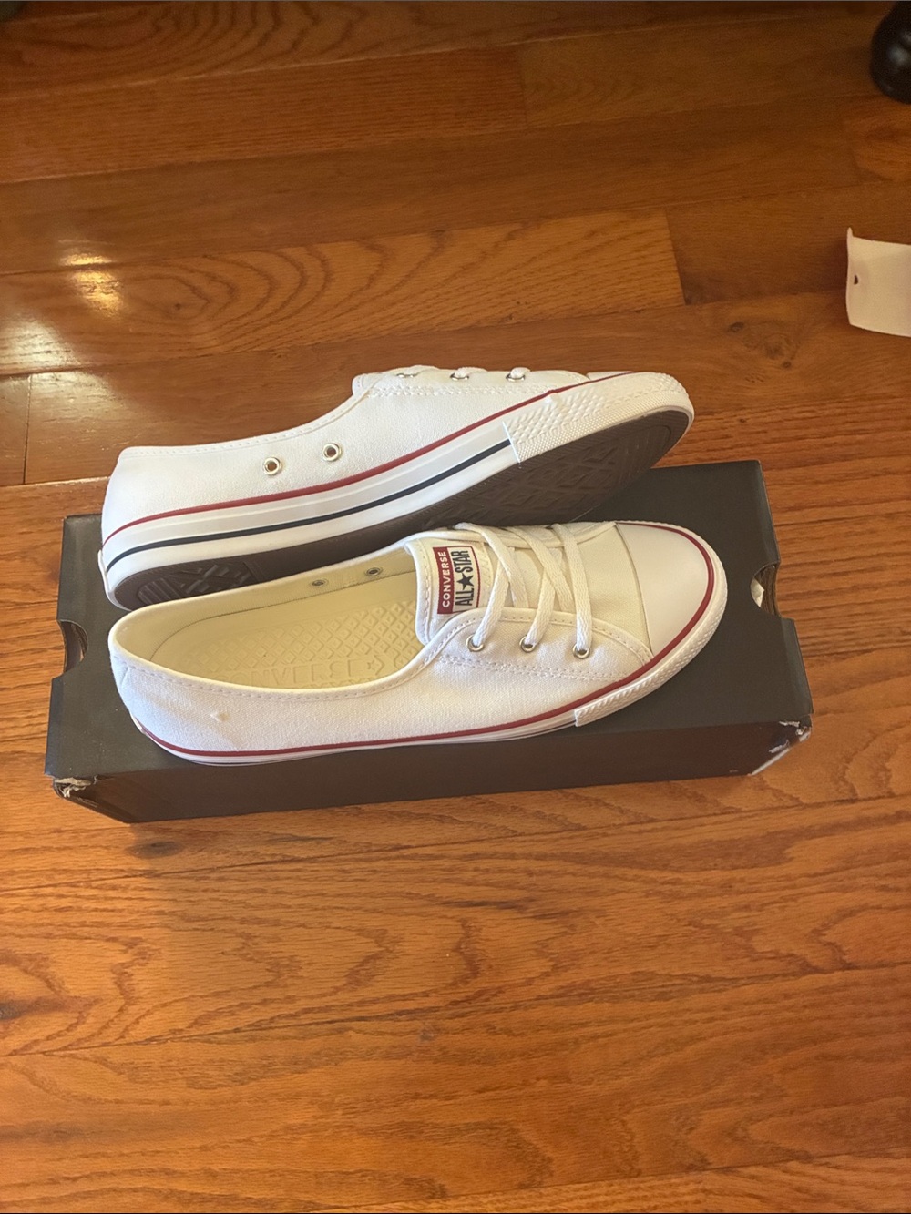 Converse White Low-Top Canvas Slip-On Sneakers with Red Trim